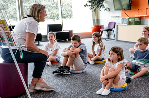 Librarian telling story to children