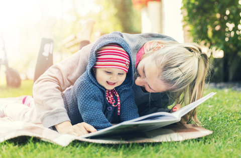 Woman reading to a Baby 