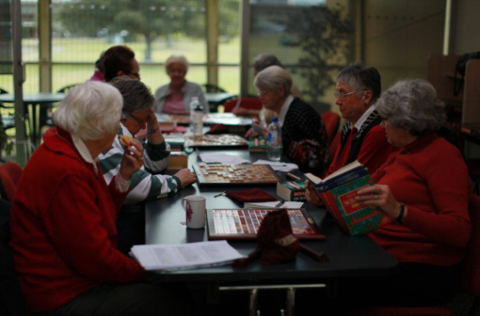 Group of women playing scrabble
