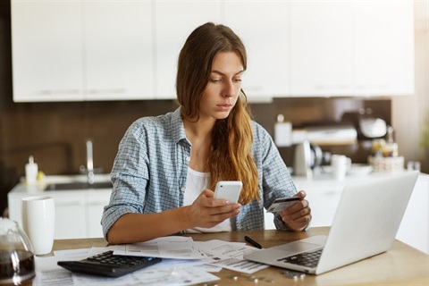 young-woman-checking-her-budget-doing-taxes.jpg