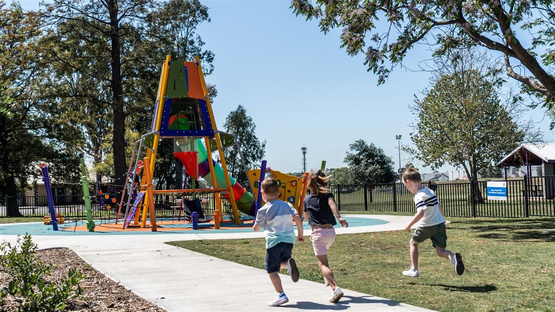 Kids-running-towards-play-equipment-at-Rose-Point-Park.jpg